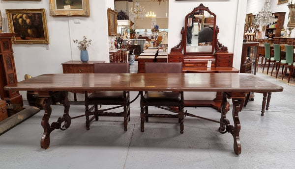 Amazing hard to find French Fruitwood Spanish style 3 meter dining table. Decorative iron work underneath and in good detailed original condition.