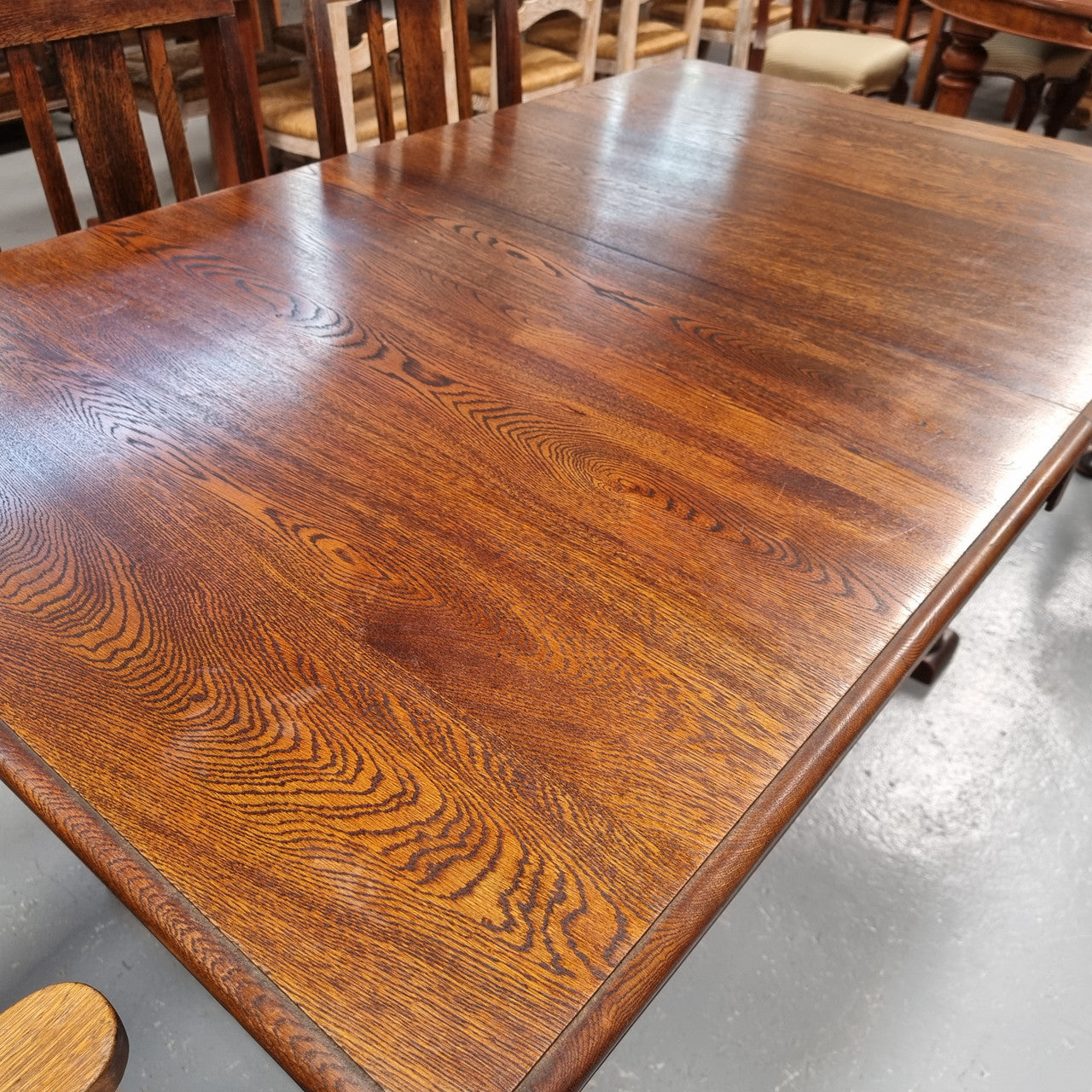 Tudor oak dining setting consisting of draw leaf extension table, 4 dining chairs and 2 carver chairs. Upholstery in excellent condition. Circa: 1930’s. The table, chair and carver chairs are in good original detailed condition.
