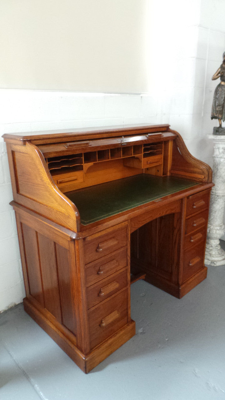 An Antique English Oak Roll Top Desk