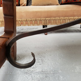 French Oak Spanish style dinner table with beautiful simple iron work underneath. Table top is in good original condition with character marks and has a wax finish. Circa 1930.