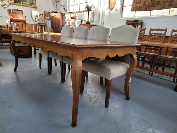 An amazing Vintage Cherry Wood dining table. Comfortably seats eight people and is in good original detailed condition.