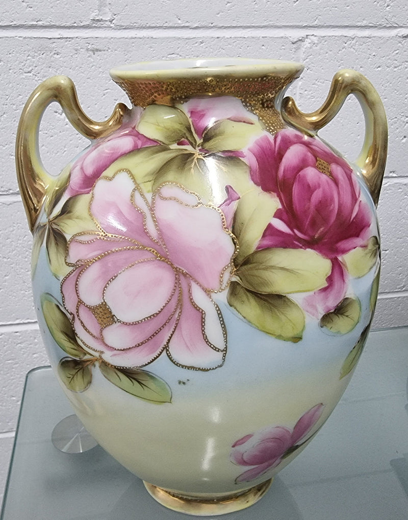 Lovely hand painted double handled vase in great original condition. Please see photos as it forms part of the description.