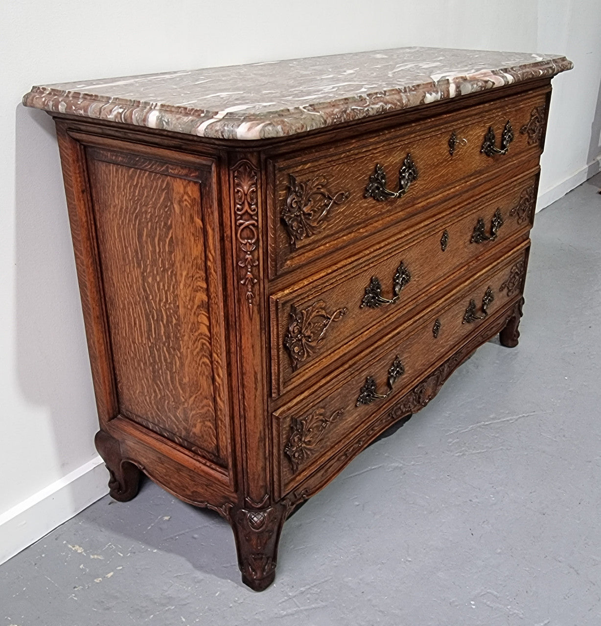 French Louis XV style three drawer Oak marble top commode. In good original detailed condition.