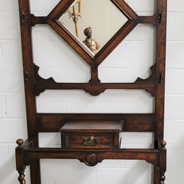Beautiful Oak Antique Jacobean hall stand, with barley twist leg and a drawer for storage in very good original detailed condition condition.