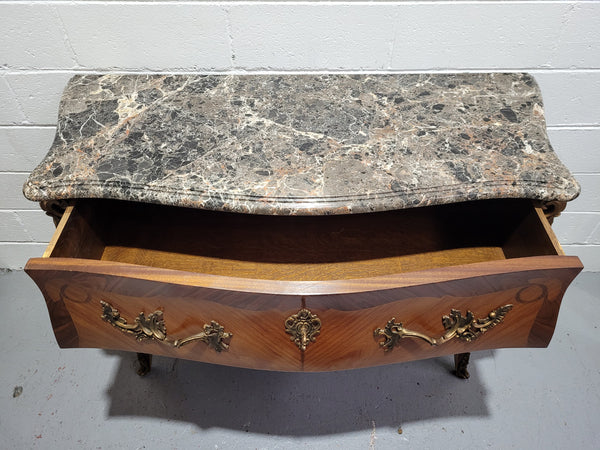 Stunning French Walnut and Rosewood Louis XV style two drawer commode with a beautiful marble top and ormolu mounts. In good original detailed condition.