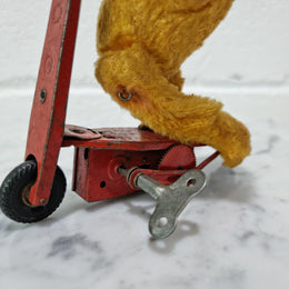 "Gebruder Fendi" bear riding scooter wind up toy, comes with original key. In good original condition, please view photos as they help form part of the description.