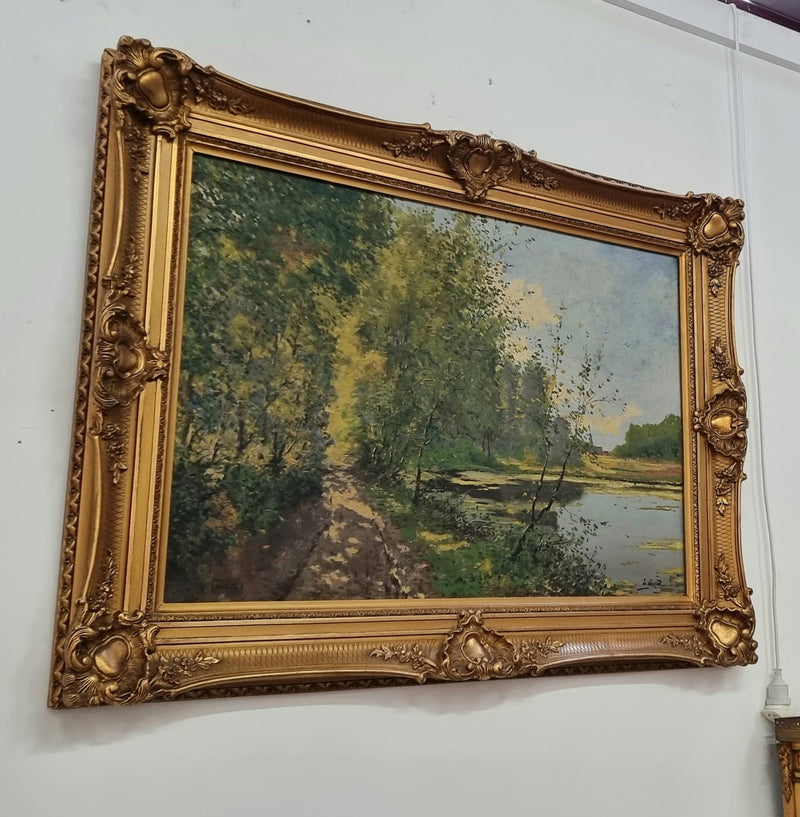 Sourced in France is this beautiful impressionist oil on canvas by "LOUIS GAROT". In a lovely ornate frame, signed and in good original condition.