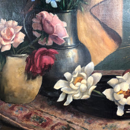 An Antique gilt-framed oil painting of floral still life. Housed in a double sweep gilt frame, signed and dated in good condition.