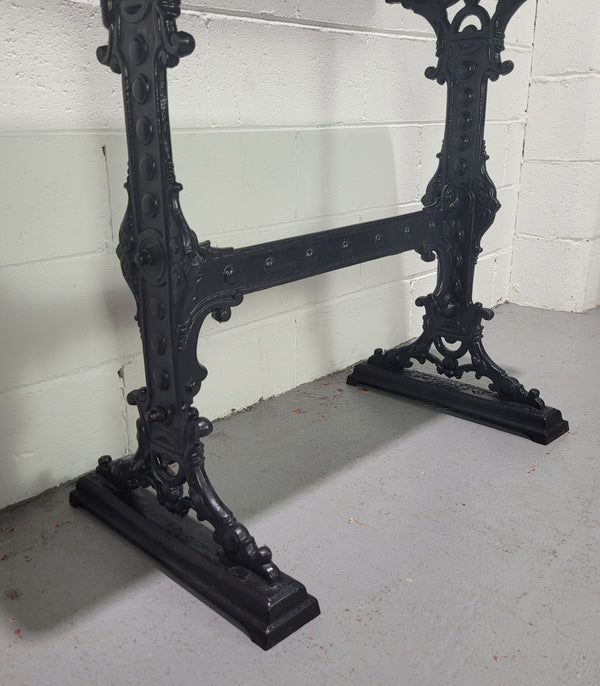 Late Victorian English Mahogany and cast iron base pub table. The foundry maker name is on the base and it is in good original detailed condition.