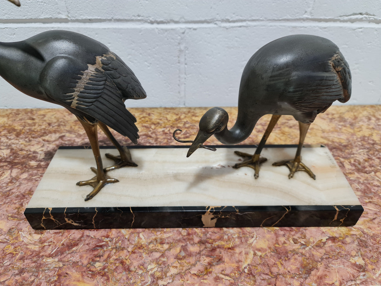 Fabulous French Art Deco cold painted spelter Ibis birds on a stylized Art Deco marble base. Signed "Rochard" circa 1930's. In good original detailed condition.
