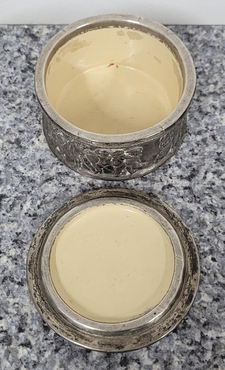 Unusual Antique silver over pottery Italian trinket box nicely decorated with Cherubs. It is in good original condition, please view photos as they help form part of the description.