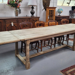 Beautilful raw solid oak French pedestal extension table. It has been sourced from France and is in good original detailed condition. When the table is fully extended it is 339 cm long and can comfortable seat 10-12 people. Features raw wood that could be used as is for a distressed look, or finished and waxed for a more refined look.