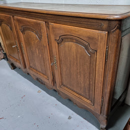 Charming French Louis 15th style sideboard with three doors and a stunning wooden top. In good detailed condition. Circa 1900