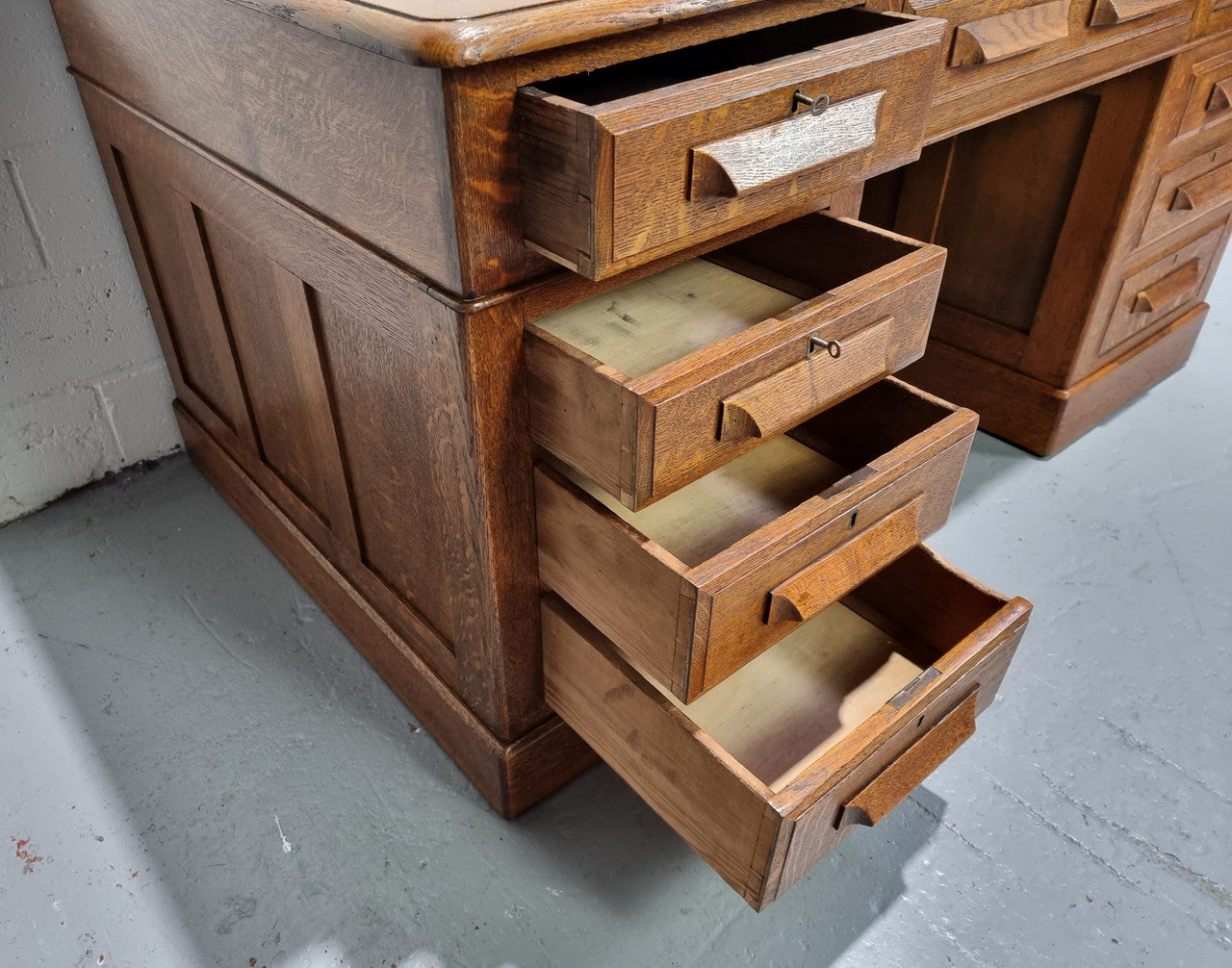 Amazing American Oak full partners leather top desk. Plenty of storage space with nine drawers on one side and two cupboards of the oppsite side. It is in good restored condition and has a new leather and gold tooled inset top.