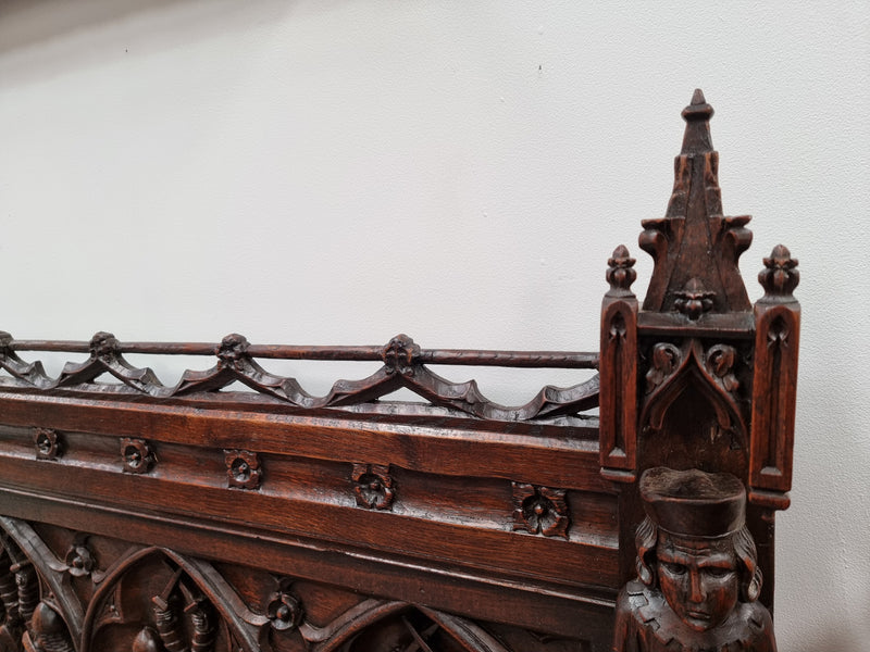 Early 19th Century French Oak Gothic style hall seat with a lift up seat. It has amazing detailed carvings and is in good original detailed condition.