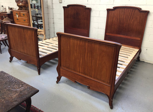 Rare French king single walnut bed, circa 1900. In good original condition. We currently have two matching kind single beds but they are being sold separately.