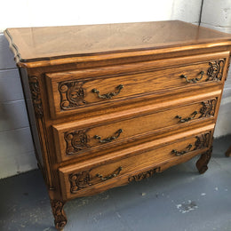 Gorgeous Provincial oak and parquetry top commode. It has beautiful carved Details and in good original detailed condition.