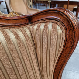 Beautiful pair of Walnut French-style newly upholstered wingback armchairs. They are in very good original detailed condition.