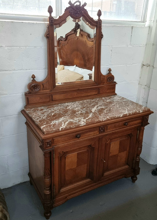 French 19th Century carved walnut Dressing table with a lovely marble top and decorative mirror. There are two cupboards and drawers for all your storage needs and in good original detailed condition.