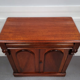 Cedar side cabinet with two doors one drawer and lovely door panels and corbels. It has been sourced locally and is in good original detailed condition.