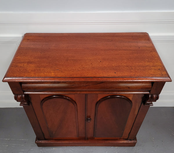 Cedar side cabinet with two doors one drawer and lovely door panels and corbels. It has been sourced locally and is in good original detailed condition.