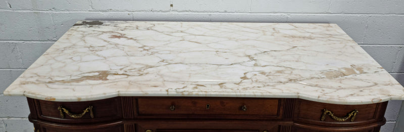 Fabulous French Walnut Louis XVI style cupboard, with a lovely marble top and nine drawers. There is also a cupboard and beautiful ormolu mounts. It is in good original detailed condition.