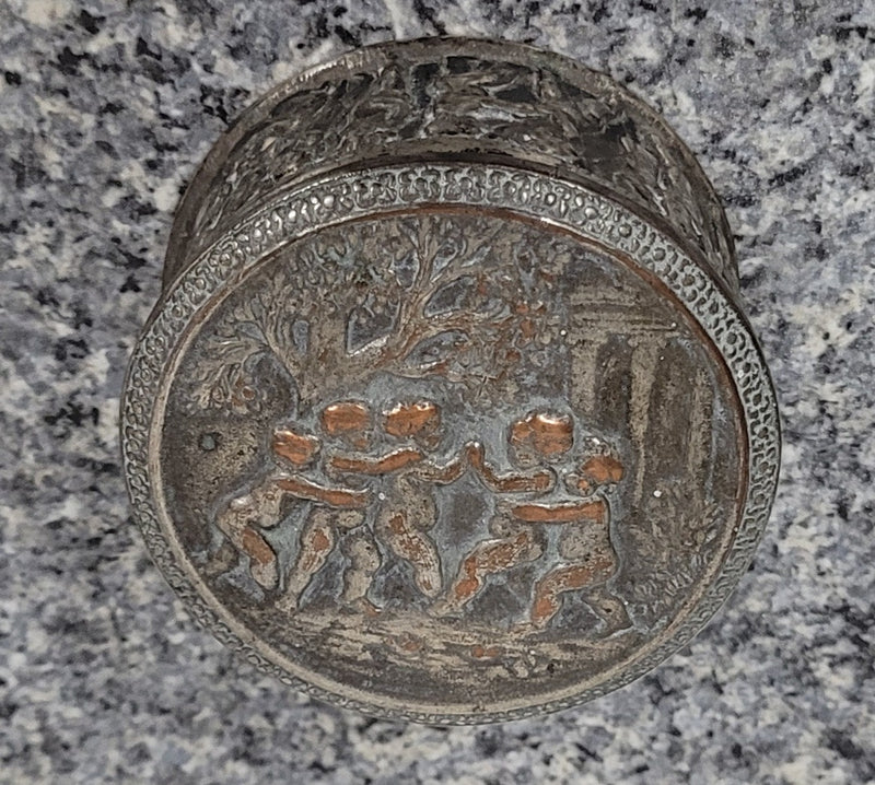 Unusual Antique silver over pottery Italian trinket box nicely decorated with Cherubs. It is in good original condition, please view photos as they help form part of the description.