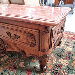 Amazing original walnut Louis XV style coffee table with a marble top, one drawer on either end and a faux drawer at the front. In good original detailed condition, sourced in France.