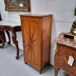 French Art Deco inlaid Oak curio/side cabinet with a lift up top and glass underneath. There are two fixed shelves, two adjustable shelves and one hidden drawer. Sourced from France and in good original condition.