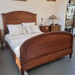 Fabulous French Walnut queen size bed with lovely detail and comes with custom made slates. It is in good original detailed condition.