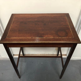Elegant rectangular mahogany French brass inlaid occasional table. Is in good original condition.